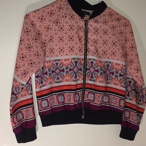 A colorful sweater with a working zipper.